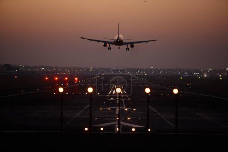 Photo for Plane taking off into the sunset at Mumbai airport - Royalty Free Image