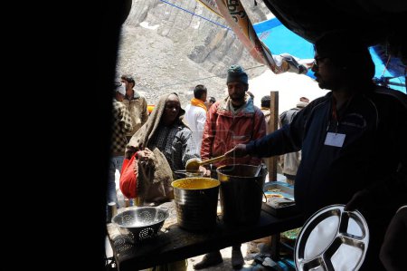 Photo for Man serving food, amarnath yatra, Jammu Kashmir, India, Asia - Royalty Free Image