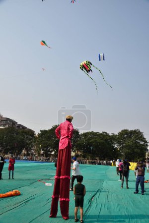 Photo for Man on stilts, International Kite Festival, Tithal, Valsad, Gujarat, India, Asia - Royalty Free Image