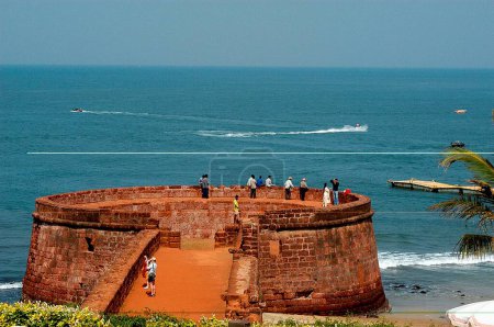 Photo for Tourists enjoying the views from the Fort Aguada in North Goa, India - Royalty Free Image