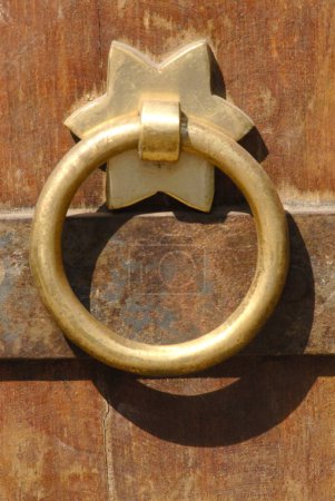 Photo for Close up of round decorative brass handle fitted on door of Vishrambaug Wada second palace of Peshve the Maratha king ; Pune ; Maharashtra ; India - Royalty Free Image