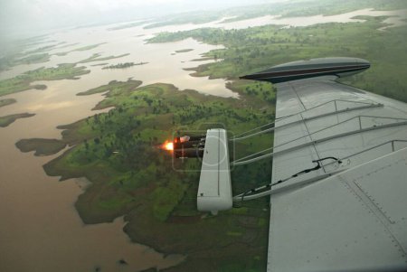 Photo for Cloud seeding by piper aircraft uppar vaitarana lake , Nashik , Maharashtra , India - Royalty Free Image