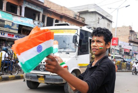 Photo for A boy selling Indian flags, Jodhpur, Rajasthan, India - Royalty Free Image