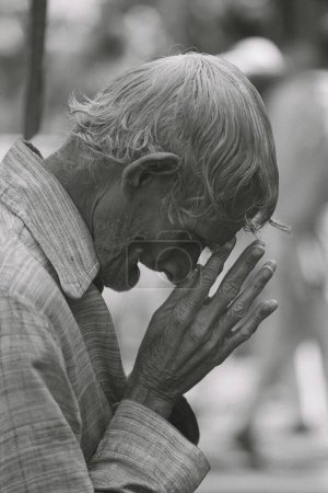 Photo for Old Indian man in deep prayer - Royalty Free Image