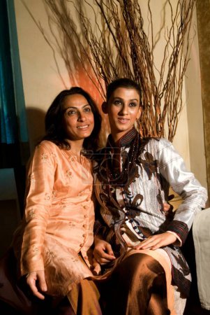 Photo for South Asian Indian fashion designer Krishna Mehta with a model at a press meet , Bombay Mumbai, Maharashtra, India - Royalty Free Image