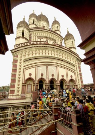 Photo for Pilgrims visited Dakshineshwar Kali Temple classic bengali hut style built in 1847 surrounded by twelve Shiva temples, Calcutta now Kolkata, West Bengal, India - Royalty Free Image