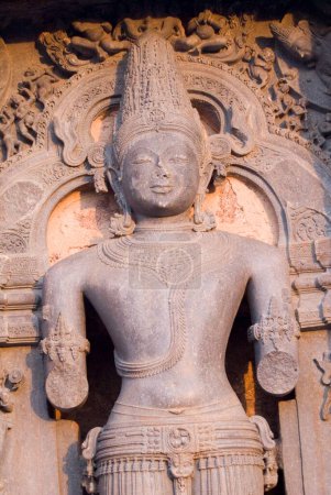 Photo for Statue of Vedic Sun god Surya or Arka in mellow mood carved on wall of Sun temple represents setting sun and faces west World Heritage monument ; Konarak ; Orissa ; India - Royalty Free Image