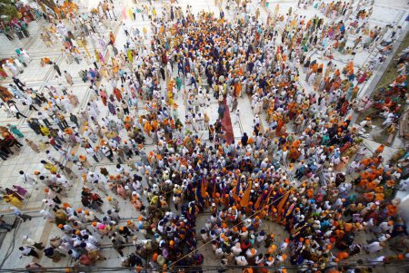 Photo for Sikh devotees taking part in procession at the Sachkhand Saheb Gurudwara for 300th year of Consecration of perpetual Guru Granth Sahib on 30th October 2008, Nanded, Maharashtra, India - Royalty Free Image