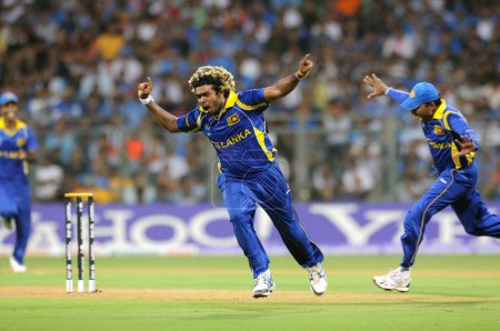 Photo for Sri Lankan bowler Lasith Malinga celebrate wicket of Indian batsman Sachin Tendulkar Not I Picture during the 2011 ICC World Cup Final between India and Sri Lanka at Wankhede Stadium on April 2 2011 in Mumbai - Royalty Free Image