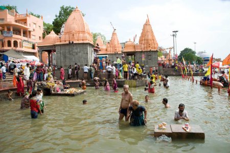Photo for Pilgrims taking holy dip in kshipra river, ujjain, madhya pradesh, india, asia - Royalty Free Image