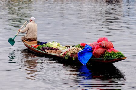 Photo for Kashmiri vegetables seller on canoe in dal lake , Srinagar , Jammu and Kashmir , India - Royalty Free Image
