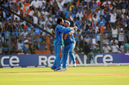 Photo for Indian all rounder Yuvraj Singh celebrate with Suresh Raina wicket of Thilan Samaraweera Not in picture during the ICC Cricket World Cup finals against Sri Lanka played at the Wankhede stadium in Mumbai on April 02 2011 - Royalty Free Image
