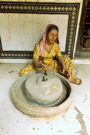 Woman grinding stone replica, Goenka Haveli Museum, Dundlod, Shekhawati, Rajasthan, India, Asia