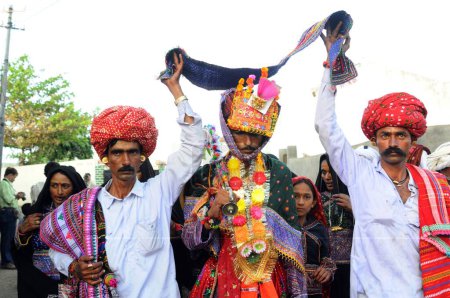 Photo for Rural marriage procession in child marriage, Mindiyada near Anjaar, Kutch, Gujarat, India - Royalty Free Image