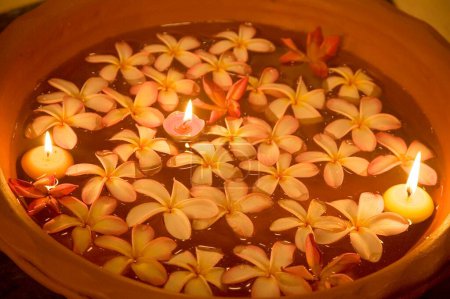 Photo for Flowers and candle light floating on water in a Spa ; Palolem beach ; Goa ; India - Royalty Free Image