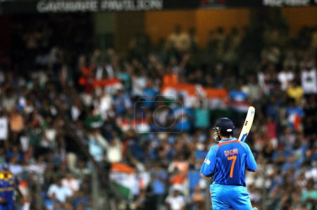 Photo for Indian captain, batsman M S Dhoni getting ready to play his shot during the 2011 ICC World Cup Final between India and Sri Lanka at Wankhede Stadium on April 2 2011 in Mumbai India - Royalty Free Image
