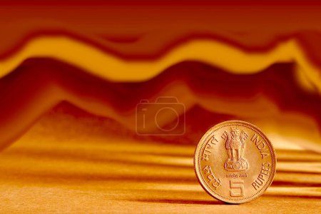 Photo for One single Indian currency five rupees coin and artistic background backside embossed Ashoka Pillar national symbols state emblem - Royalty Free Image
