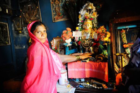 Photo for Prostitute with goddess yellama idol in kamathipura, Bombay Mumbai, Maharashtra, India - Royalty Free Image