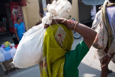 Photo for Woman carrying belongings Haridwar Uttarakhand India Asia - Royalty Free Image