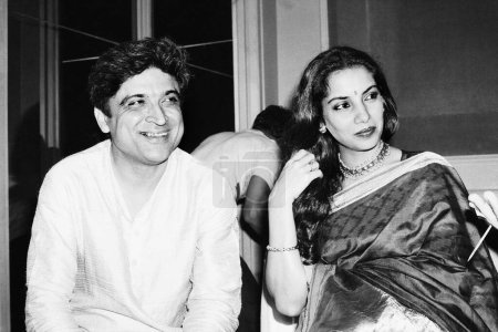 Photo for Indian old vintage 1980s black and white bollywood cinema hindi movie film actor, India, Javed Akhtar, Indian Lyricist, Shabana Azmi, Indian actress - Royalty Free Image