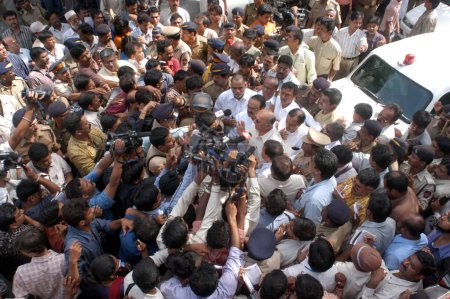 Photo for Media thronged to get reactions of chief minister of Maharashtra Sushil Kumar Shinde along with home minister Chhagan Bhujbal and state minister Kripa Shanker Singh arrived at blast site to assess the situation at Zaveri Bazaar in busy Kalbadevi area - Royalty Free Image