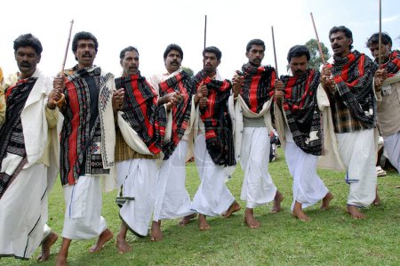 Photo for Toda men sang and danced in a circle during Toda wedding, Nilgiris, Tamil Nadu, India - Royalty Free Image