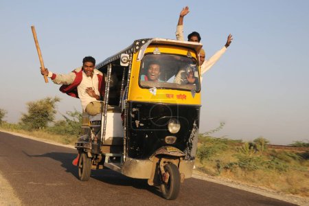 Photo for People taking risk riding on autorickshaw, Pushkar, Rajasthan, India - Royalty Free Image