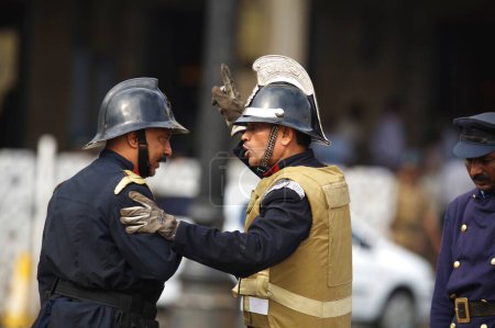 Photo for Personnel from fire brigade outside Taj Mahal hotel during terrorist attack, Bombay Mumbai, Maharashtra, India - Royalty Free Image