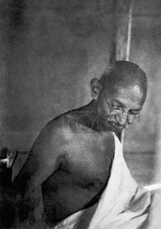 Photo for Mahatma Gandhi in his hut at Sevagram Ashram, 1939 - Royalty Free Image