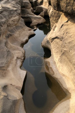 Abstract form of rock patterns with water logged ; Nighoj ; Pune ; Maharashtra ; India 8-March-2009