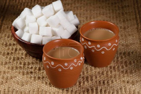 cup of Indian Kulhad tea with sugar cubes, India, Asia