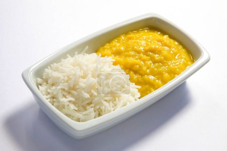 Photo for Vegetarian , Indian cuisine dal bhath boil basmati rice bhath chaval oryza sativa and moong dal mung beans phaseolus aureus served in plate - Royalty Free Image