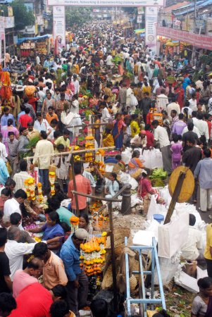 Photo for Crowd in flower market purchasing articles used to decorate idols of Lord Ganesh, celebrating Ganapati festival at Dadar, Bombay Mumbai, Maharashtra, India - Royalty Free Image