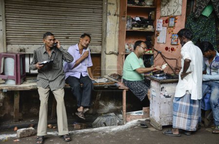 Photo for People talking on phones, Kolkata, West Bengal, India, Asia - Royalty Free Image