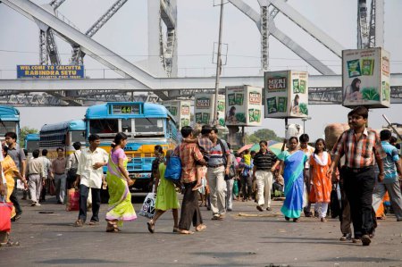 Photo for Street Scene ; View of Howrah Bridge now Rabindra Setu over River Hooghly ; Calcutta Kolkata ; West Bengal ; India - Royalty Free Image