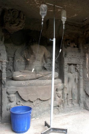 A Chemical Conservation of the statues of the Buddha being carried on in the UNESCO World Heritage site  Ajanta Caves in Maharashtra ; India