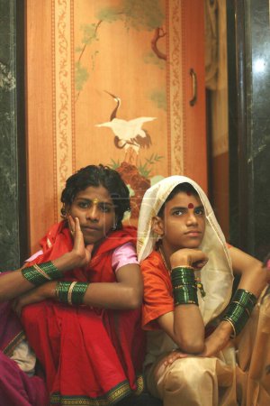 Photo for Eunuchs dressed in traditional sari ; wedding of eunuchs on occasion of Bewa Purnima at Ghatkopar ; Bombay now Mumbai ; Maharashtra ; India - Royalty Free Image