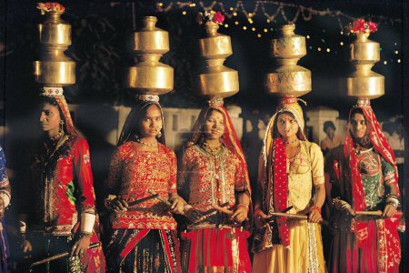 Photo for Women folk dancing dandiya with balancing pot on head, kutch, gujarat, india, asia - Royalty Free Image