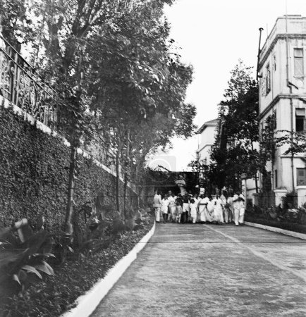 Photo for Mahatma Gandhi and others going for prayer at Rungta House ; Mumbai ; 1945 ; India - Royalty Free Image