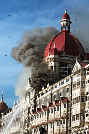 Photo for Fire inside of Taj Mahal hotel after terrorist attack by deccan mujahedeen on 26th November 2008 in Bombay Mumbai, Maharashtra, India - Royalty Free Image