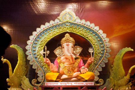 Richly decorated idol of Lord Ganesh elephant headed god ; Ganapati festival at Babu Genu Mandal ; Pune ; Maharashtra ; India