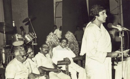 Photo for South Asian Indian Bollywood actor Amitabh Bachchan speaking at a function as Bal Thackeray looks on, India - Royalty Free Image