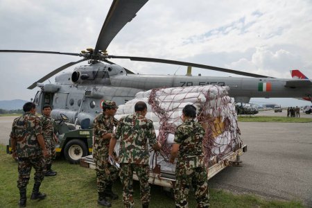 Photo for Army unload relief material distributed earthquake affected, nepal, asia - Royalty Free Image