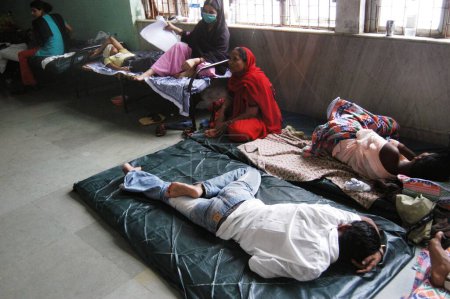 Photo for Patients being treated in the corridors of a municipal hospital due to over crowding, 26 July 2005 floods, Bombay Mumbai, Maharashtra, India - Royalty Free Image