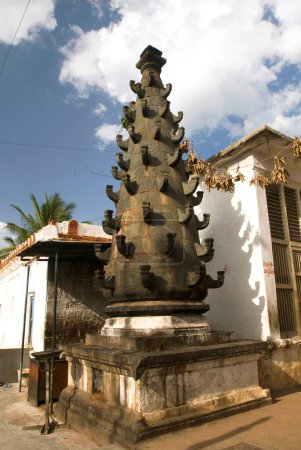 Granite oil lamp in Banashankari Hindu temple dedicated to Shakambhari or goddess Parvathi near Badami , Bijapur district , Karnataka , India