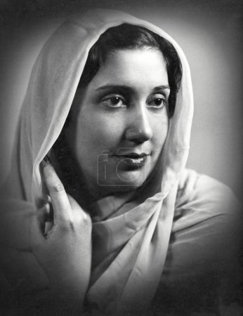 Photo for Indian woman in dress head covered portrait in studio; Kulri; Mussoorie,  Uttar Pradesh; India 1940s - Royalty Free Image