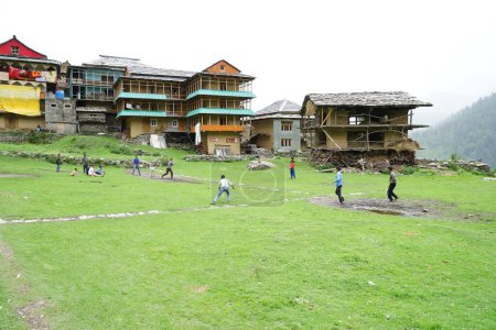 Photo for Children playing cricket, Sarchi Village, Tirthan Valley, Himachal Pradesh, India, Asia - Royalty Free Image