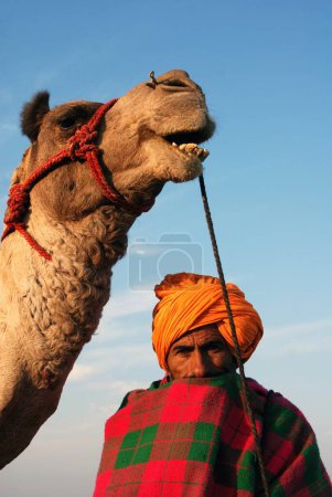 Photo for Man and camel, Khuri Khuhri, Jaisalmer, Rajasthan, India - Royalty Free Image
