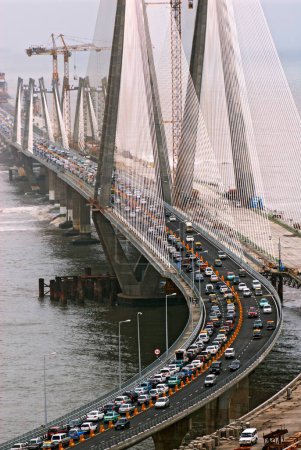 Photo for Traffic on opening day of bandra worli known rajiv gandhi sea link, Bombay Mumbai, Maharashtra, India 1-July-2009 - Royalty Free Image