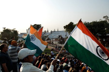 Photo for Audience in retreat ceremony called lowering flag at India-Pakistan international border ; Wagah border ; Attari ; Punjab ; India - Royalty Free Image